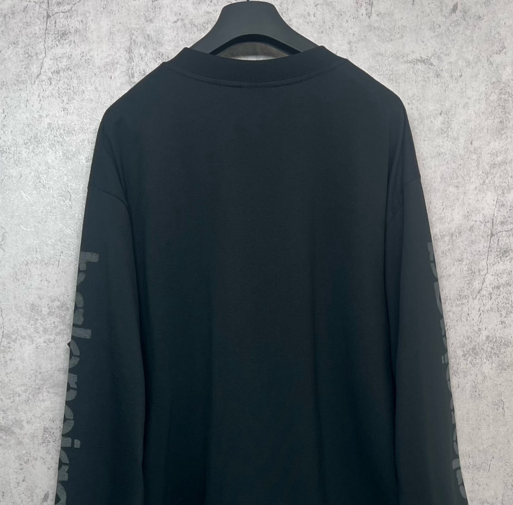 Balenciaga long-sleeve T-shirt, dark back view with sleeve logo text