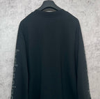 Balenciaga long-sleeve T-shirt, dark back view with sleeve logo text
