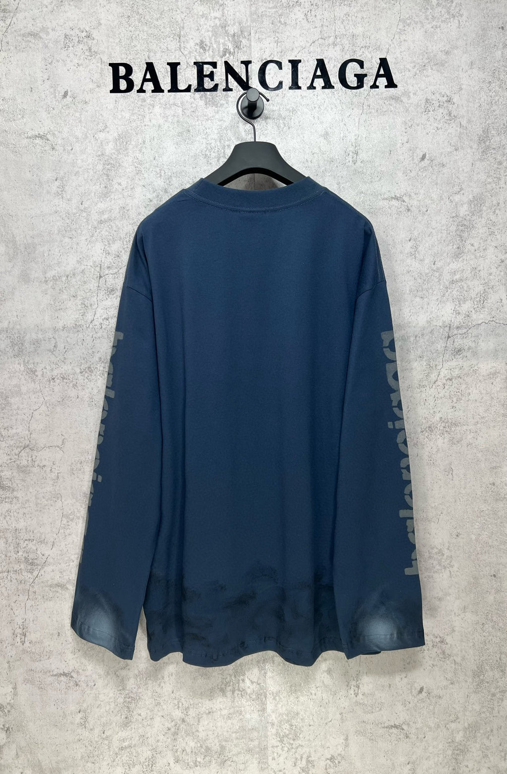 Long-sleeve crewneck T-shirt, dark blue, back view with side logo graphics
