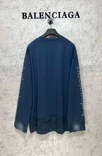 Long-sleeve crewneck T-shirt, dark blue, back view with side logo graphics