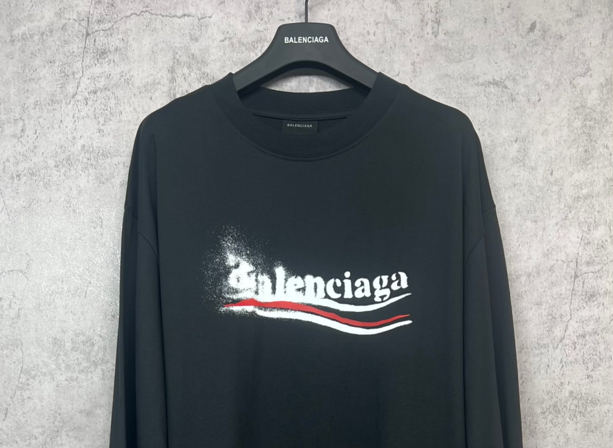 Black long-sleeve shirt with Balenciaga logo print and crew neckline