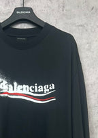 Black long-sleeve shirt with Balenciaga logo on front, side view