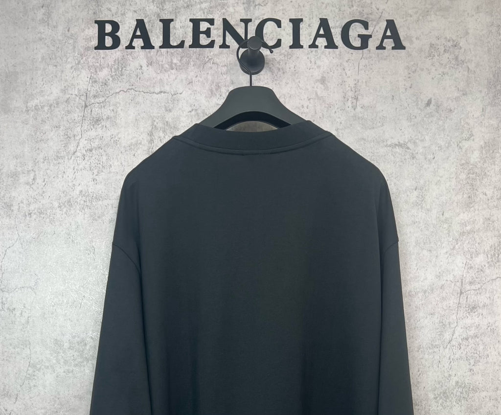 Black long-sleeve shirt back view, no visible logo