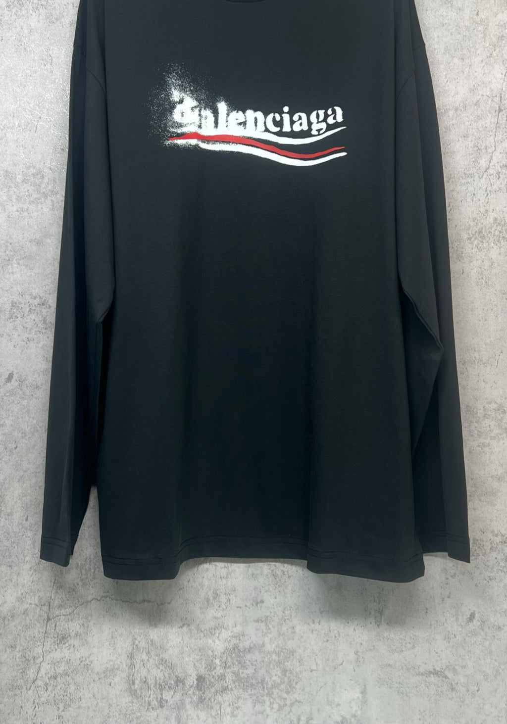 Black long-sleeve shirt full view with Balenciaga logo print at center