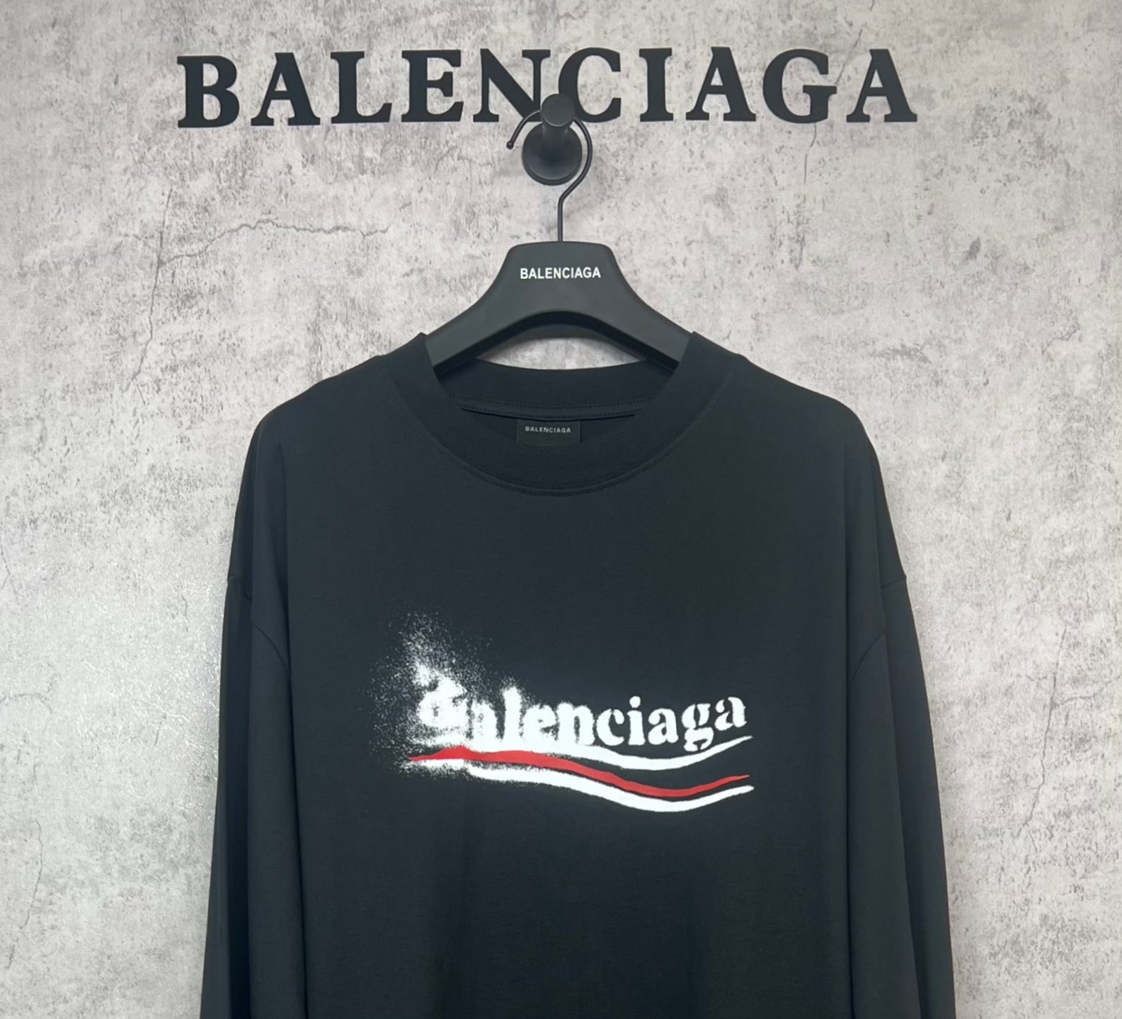 Black long-sleeve shirt with large Balenciaga logo print on chest