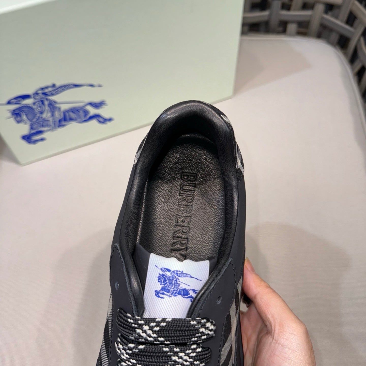 Burberry black sneaker heel with printed insole label, close-up