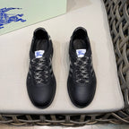 Burberry black leather sneakers with check-pattern laces, front view