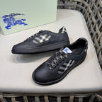 Burberry black sneakers with plaid panel, lace-up front, angled view