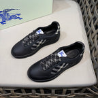 Burberry black sneakers with check-pattern laces and plaid accents, side view
