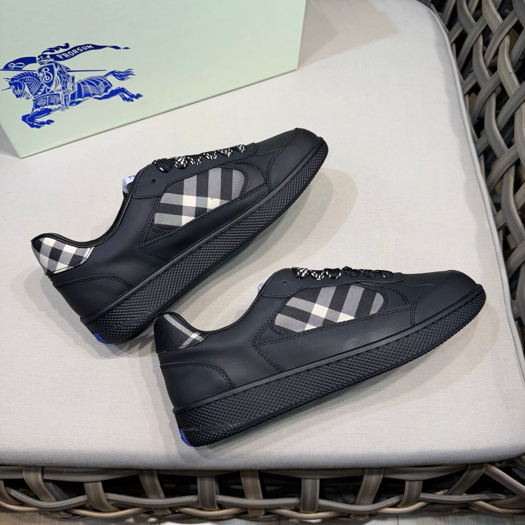 Burberry black sneakers with plaid tongue and textured sole, pair view