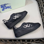 Burberry black sneakers with plaid tongue and textured sole, pair view