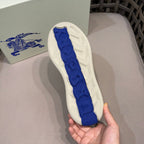 Burberry sneaker outsole close-up, textured sole with blue printed traction pattern