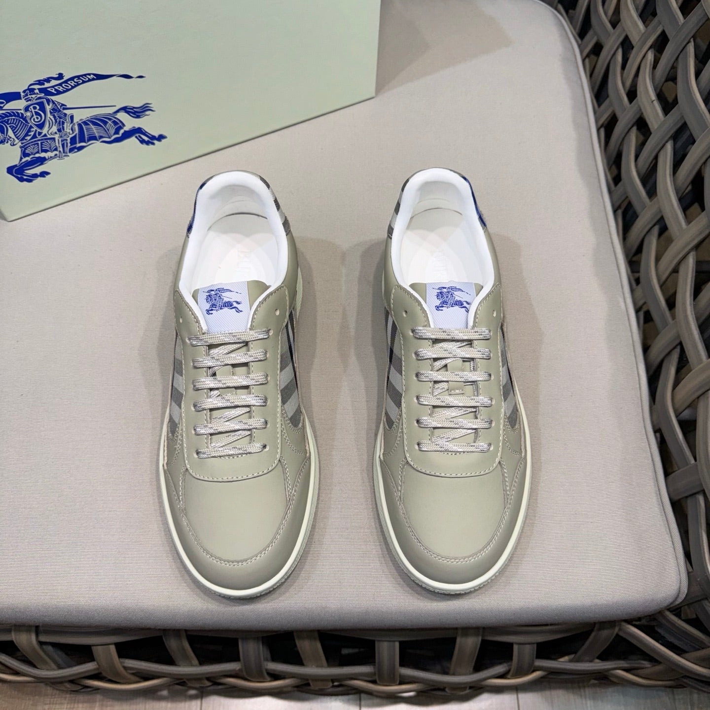 Burberry low-top sneakers in light beige with blue laces and side check panel