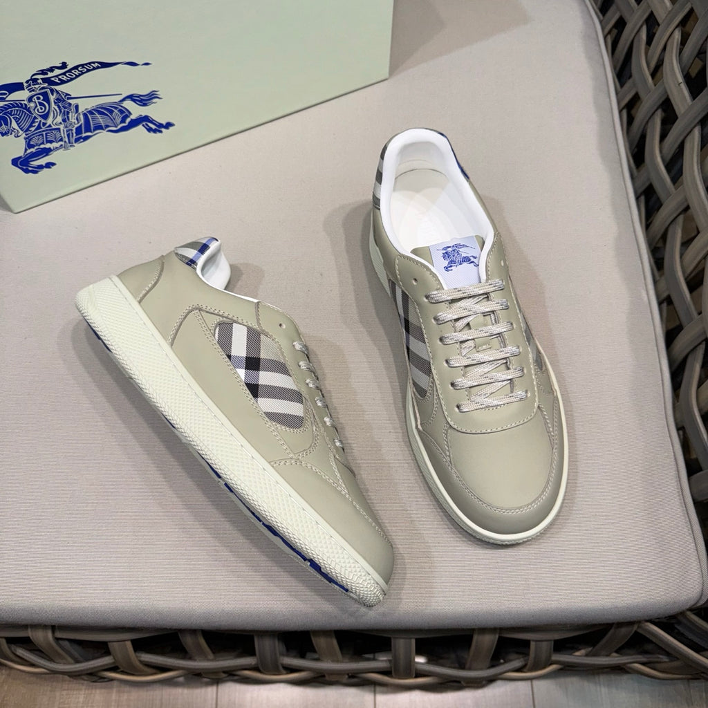 Burberry low-top sneakers, one shoe angled, beige leather with check-styled side panel