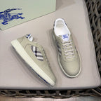 Burberry low-top sneakers, one shoe angled, beige leather with check-styled side panel