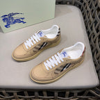 Beige leather sneakers with white laces, check detail, and gum sole