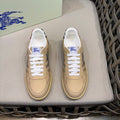 Beige leather sneakers with white laces and check side panels