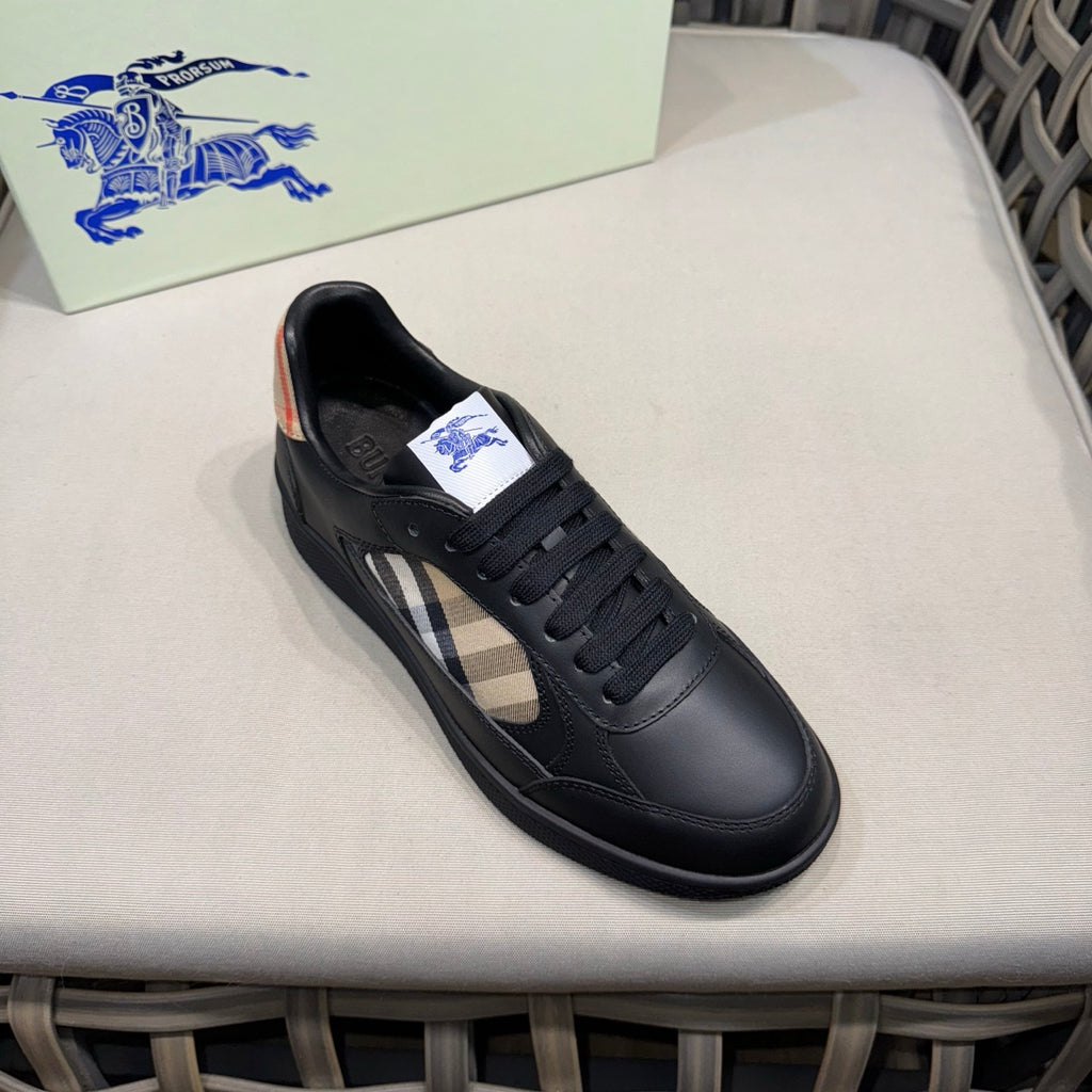 Black leather low-top sneakers with side check panel and logo tongue
