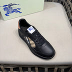 Black leather low-top sneakers with side check panel and logo tongue