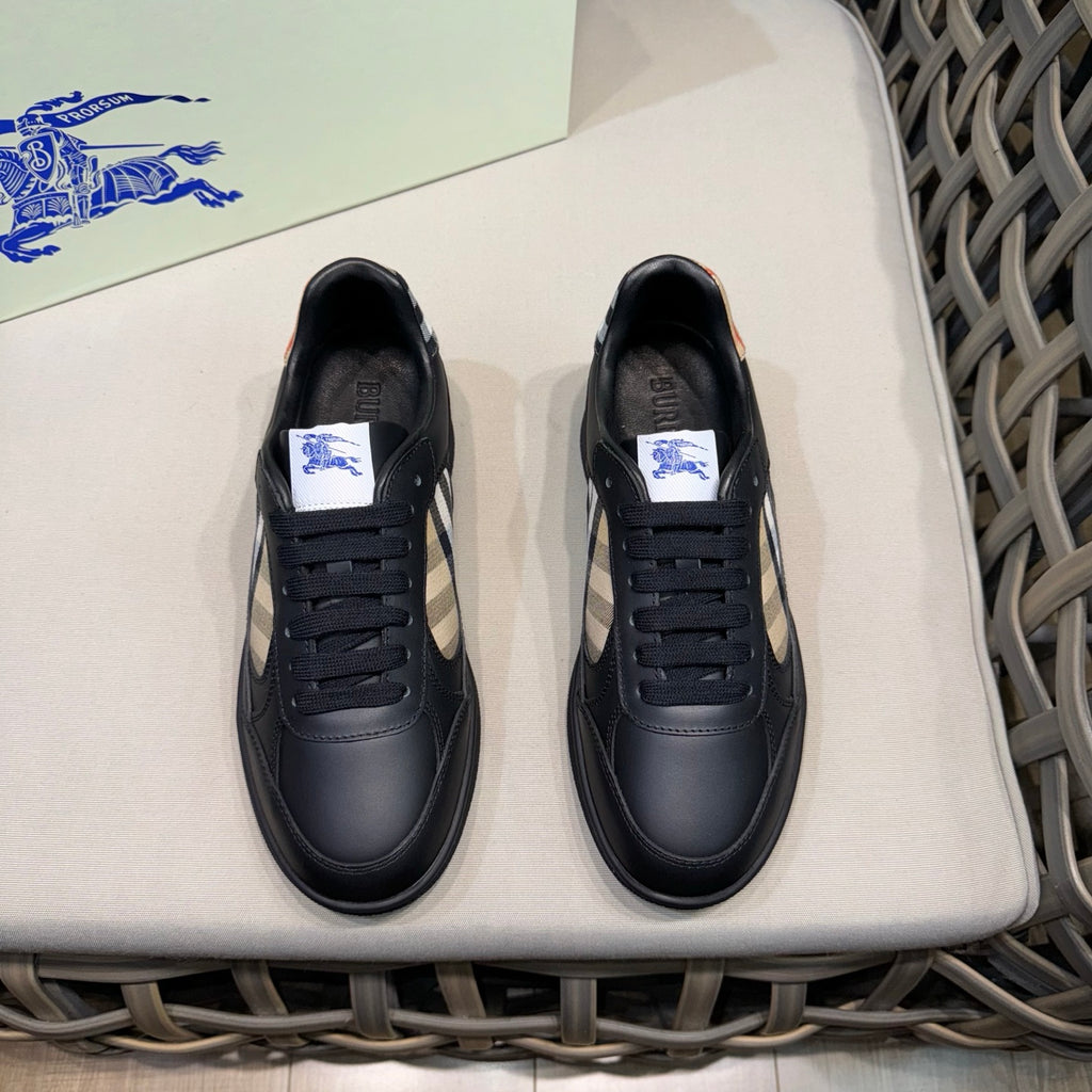 Black leather low-top sneakers with lace-up front and check panel detail