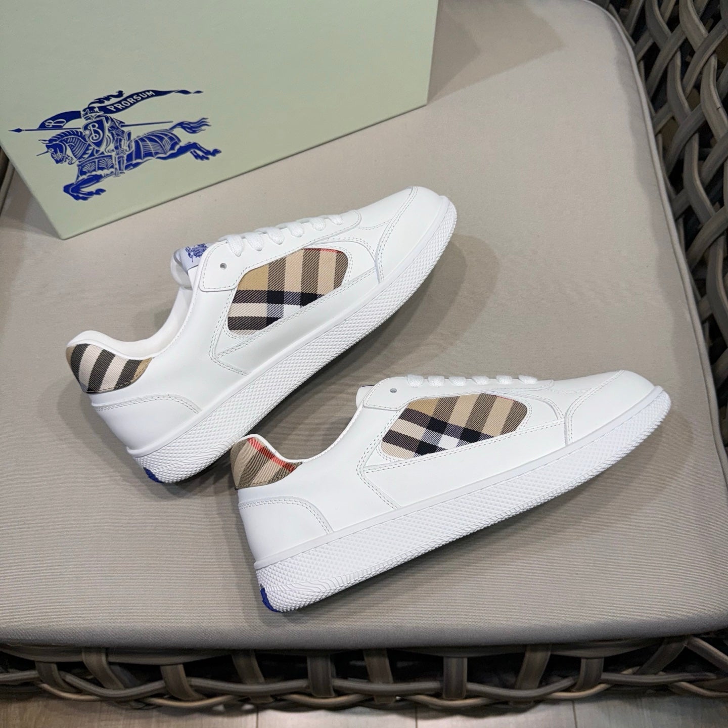 White leather lace-up sneakers with check side panels and blue horse logo