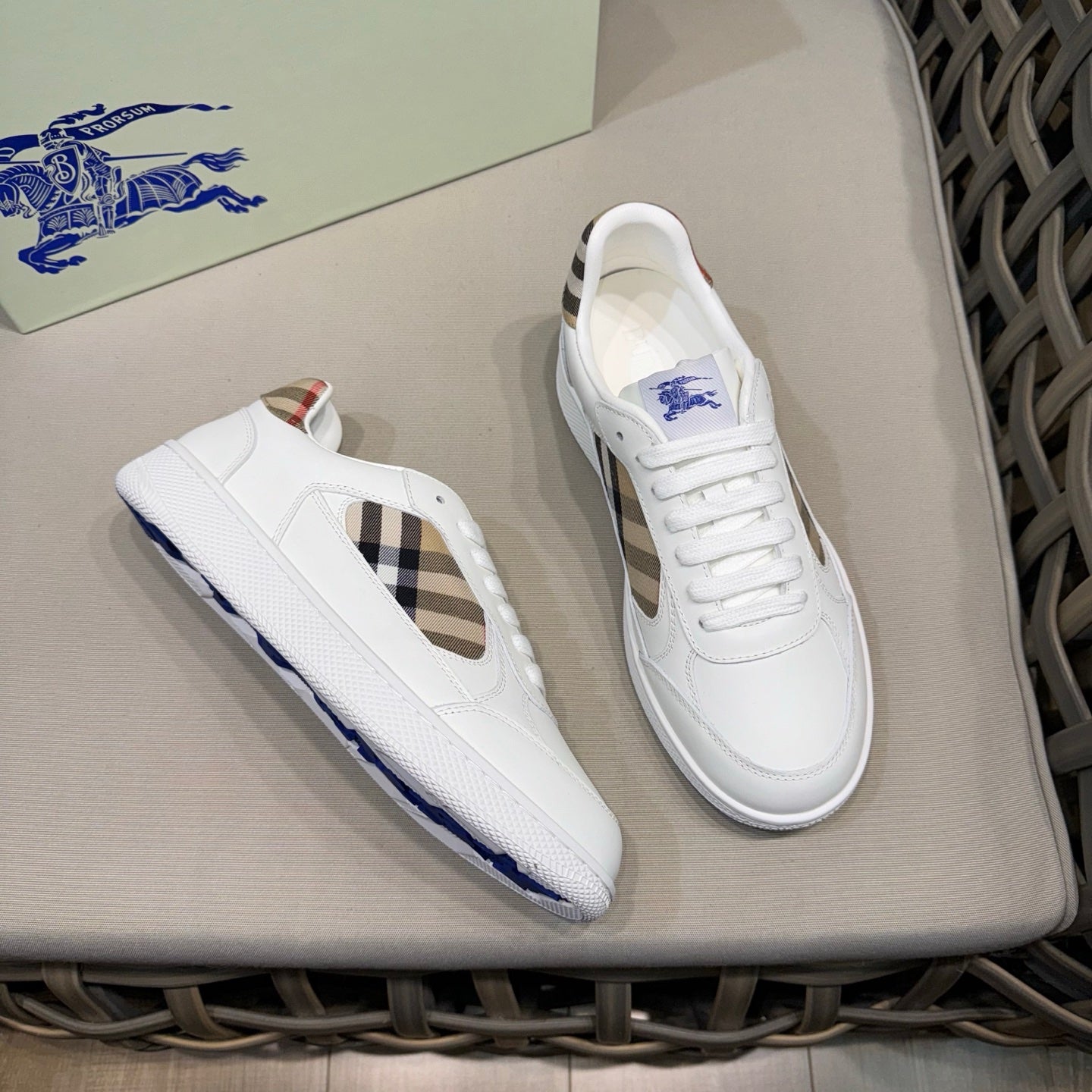 White leather lace-up sneakers with check side cutout and blue trim