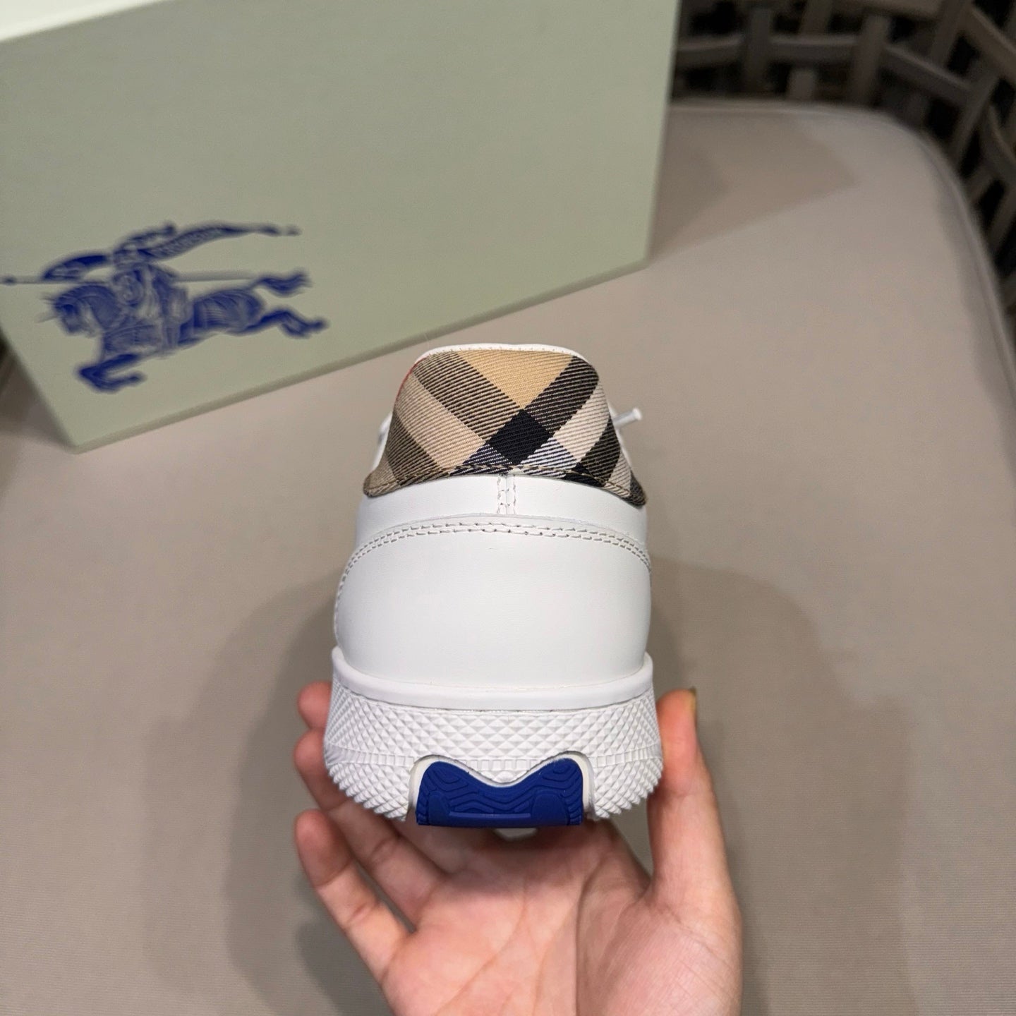 White leather sneaker heel with check fabric collar and blue logo