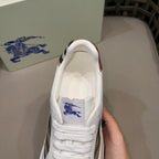 White leather lace-up sneaker with check tongue lining and blue logo
