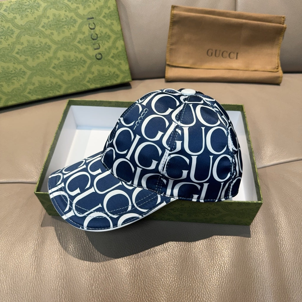 Gucci baseball cap front view in navy with white GG monogram and curved visor