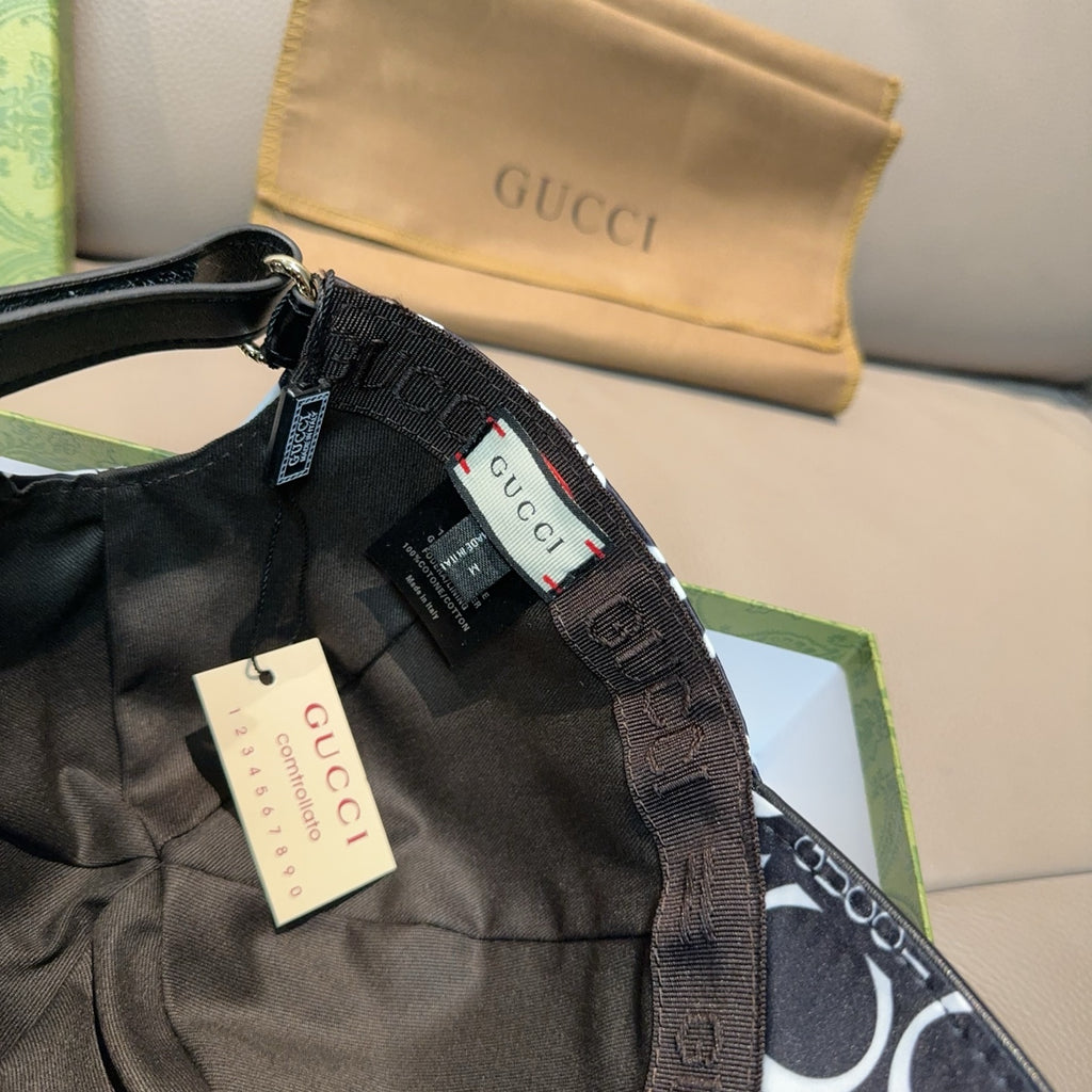 Gucci cap with adjustable black strap and GG logo fabric, hang tag visible