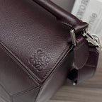 Loewe dark brown leather front panel with embossed logo and stitched seams