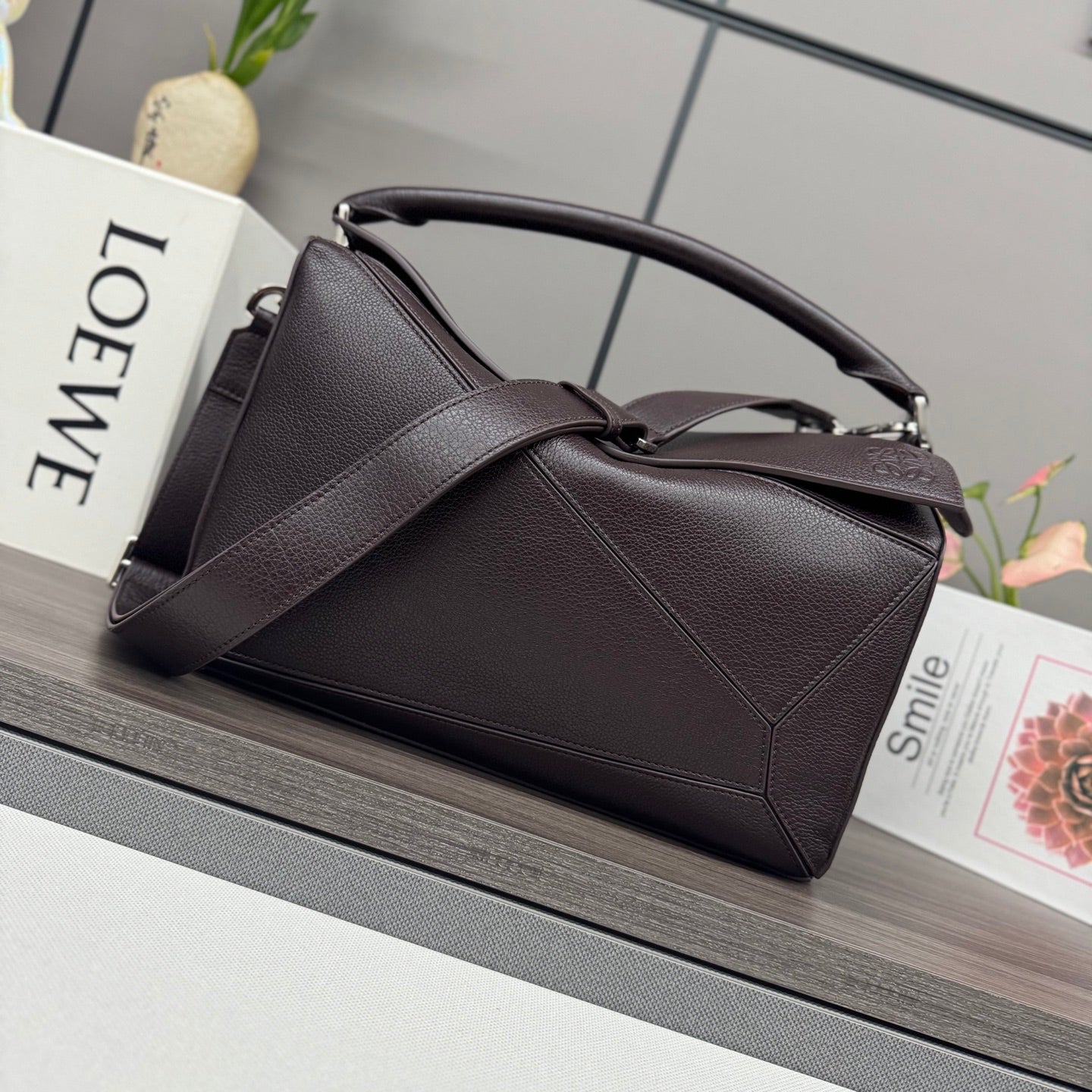 Loewe dark brown leather handbag with top handles and structured shape