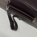 Loewe dark brown leather bag with adjustable crossbody strap and silver buckle