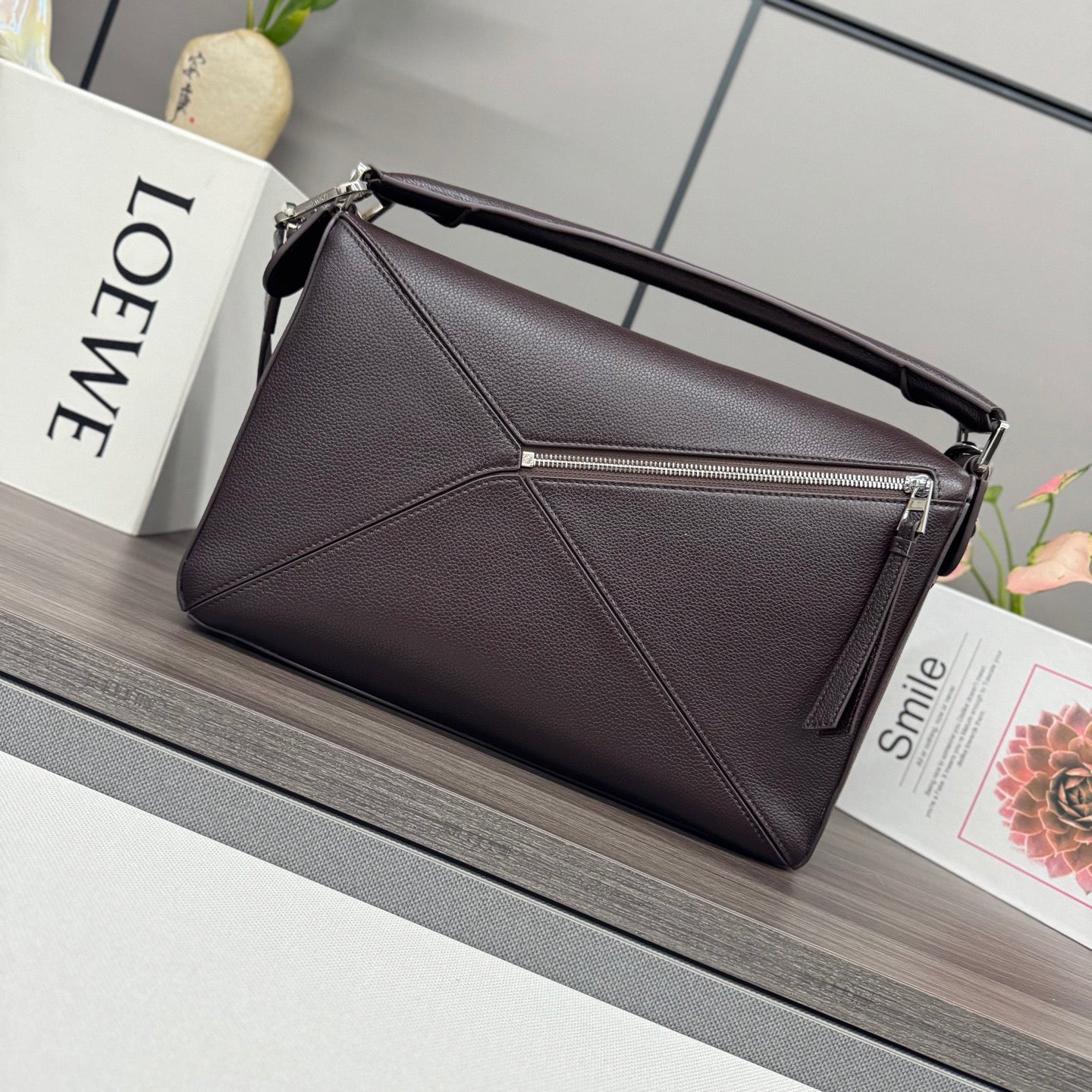 Loewe dark brown leather shoulder bag with zip top and long strap