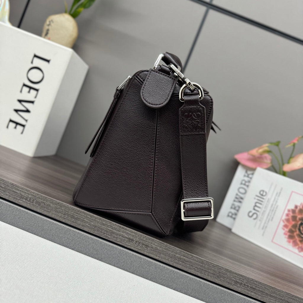 Loewe dark brown leather crossbody bag with flap, snap closure, and ring strap