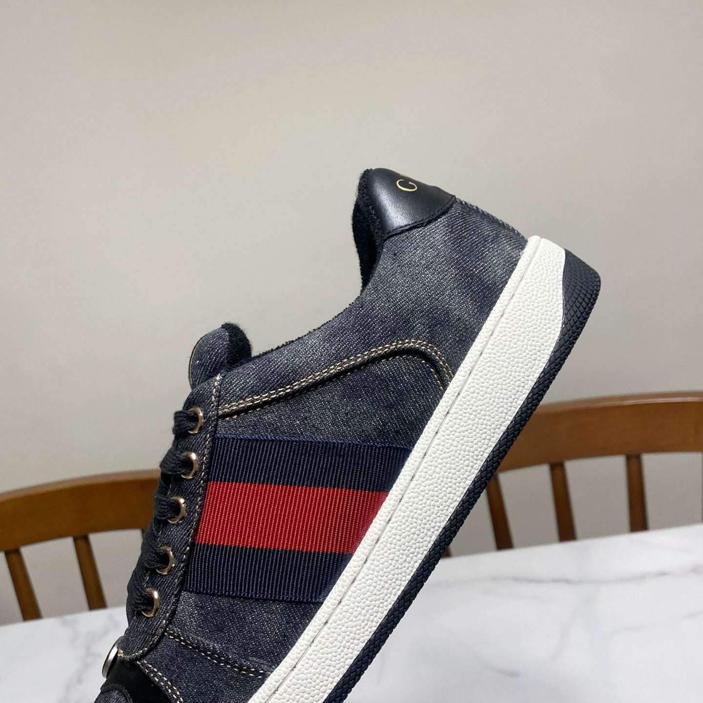 Gucci unisex denim sneaker side, dark blue with red-and-blue stripe and white midsole