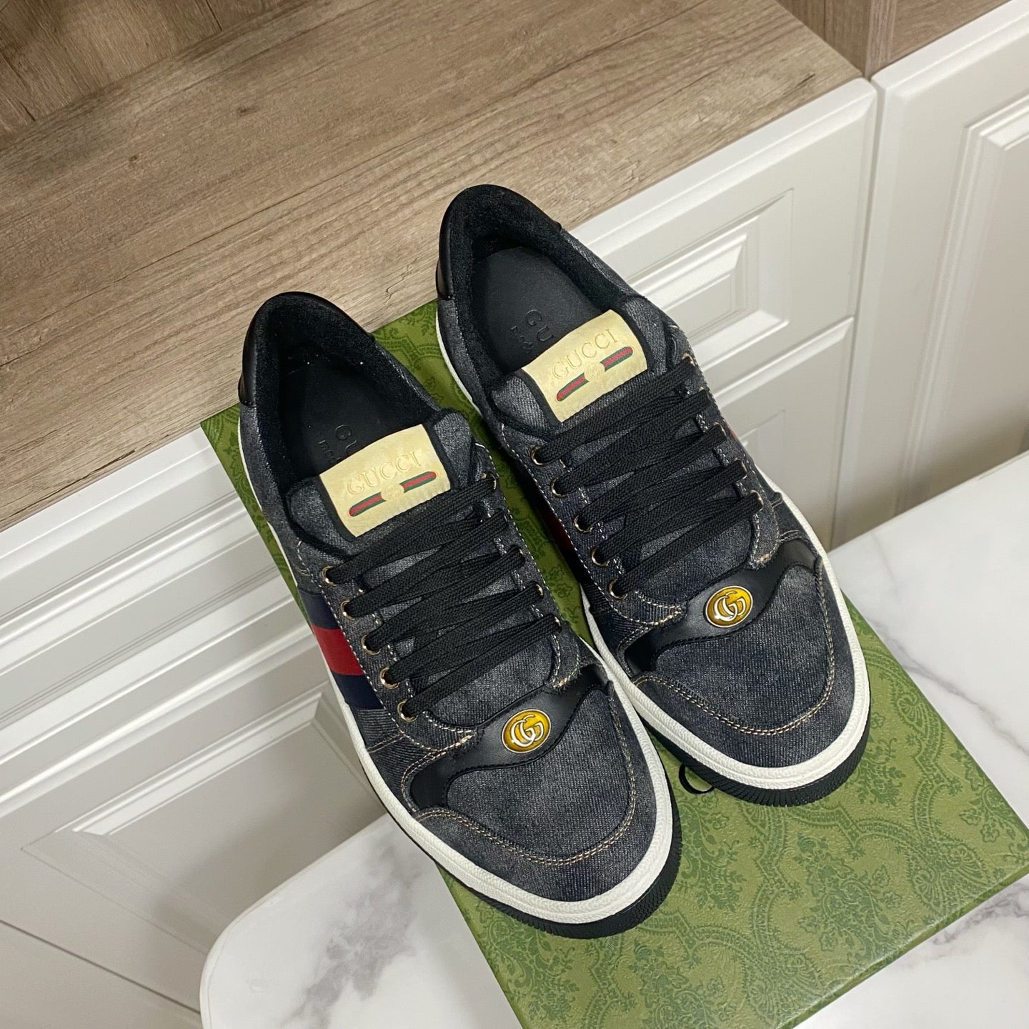 Gucci unisex denim sneakers, dark blue with gold laces, red-and-blue stripe panel, white sole