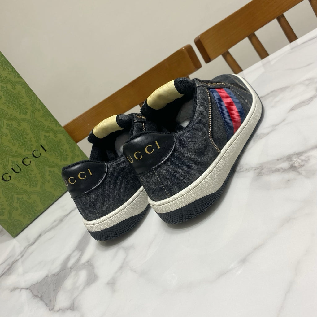 Gucci unisex denim sneakers, close view of toes and heels with red-and-blue stripe accents