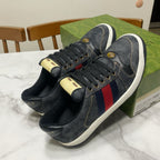 Gucci unisex denim sneakers, dark blue with red-and-blue stripe detail, gold-tone hardware