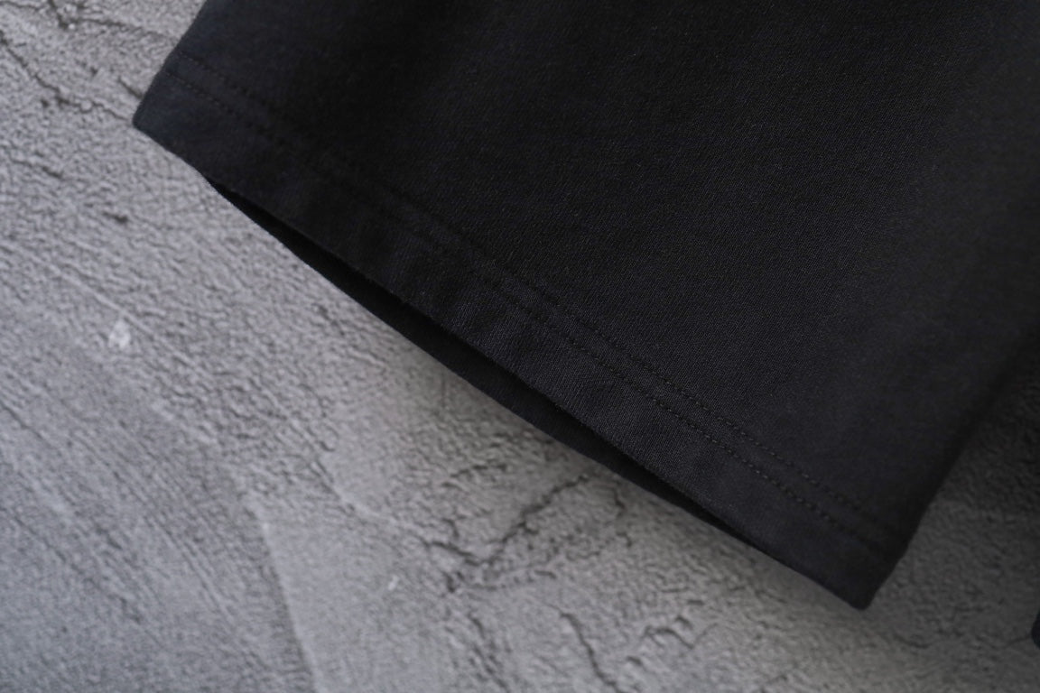 Black pants hem with visible seam stitching
