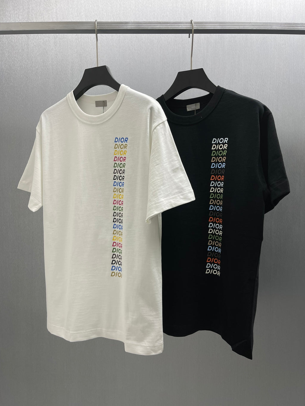 Pair of short-sleeve T-shirts, one white and one black, each with Dior logo