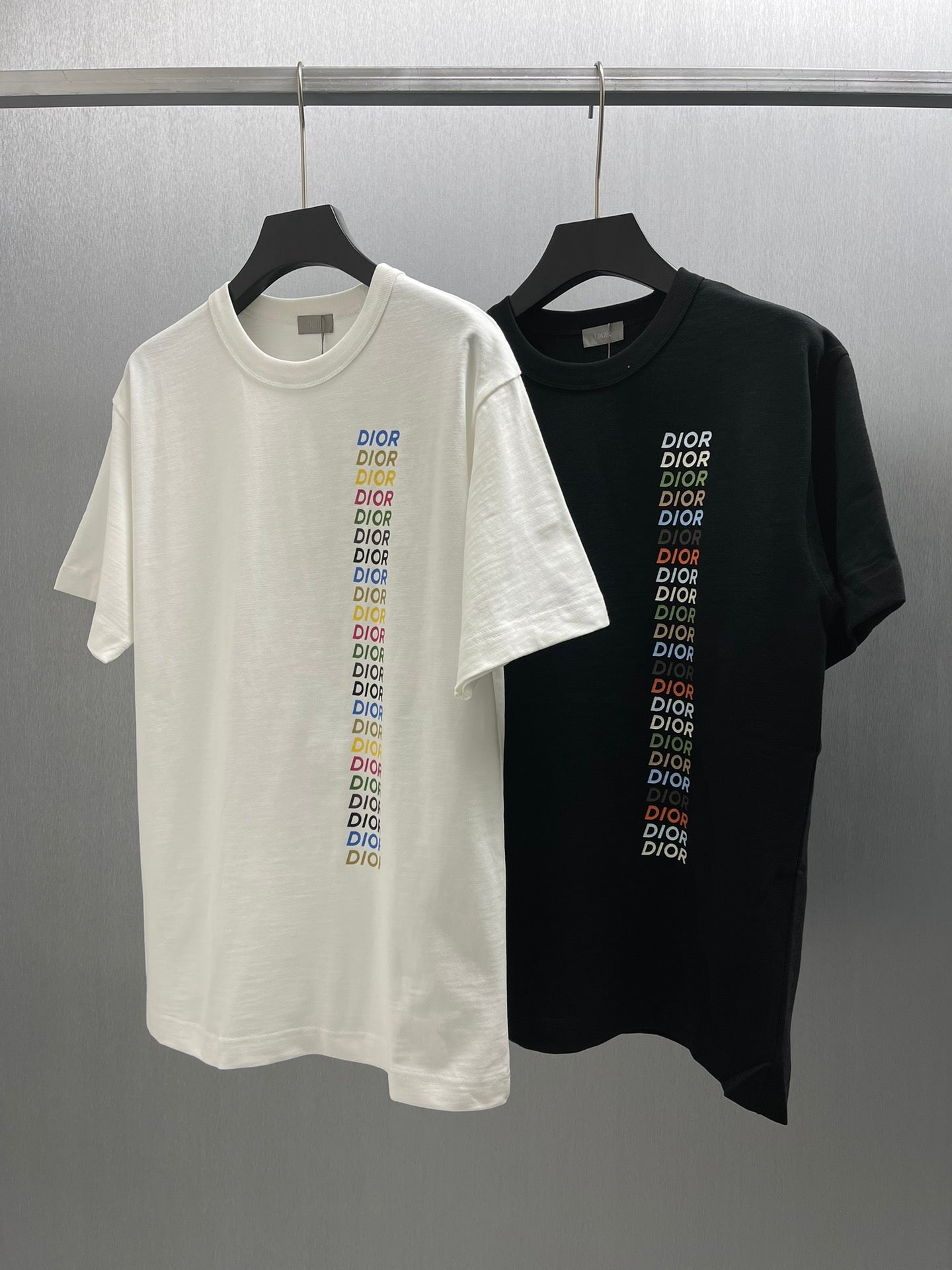 Pair of short-sleeve T-shirts, one white and one black, each with Dior logo