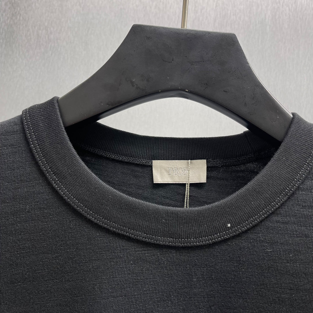 Black crewneck short-sleeve T-shirt with ribbed collar and neck tag