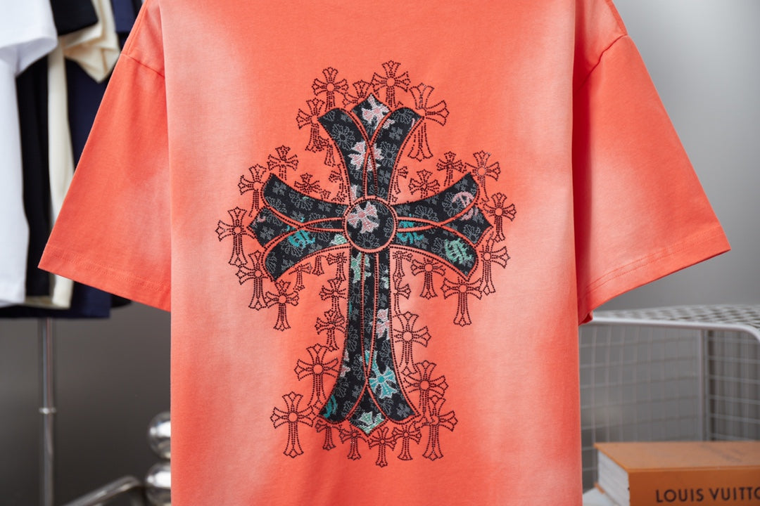 Coral short-sleeve T-shirt with large ornate cross graphic