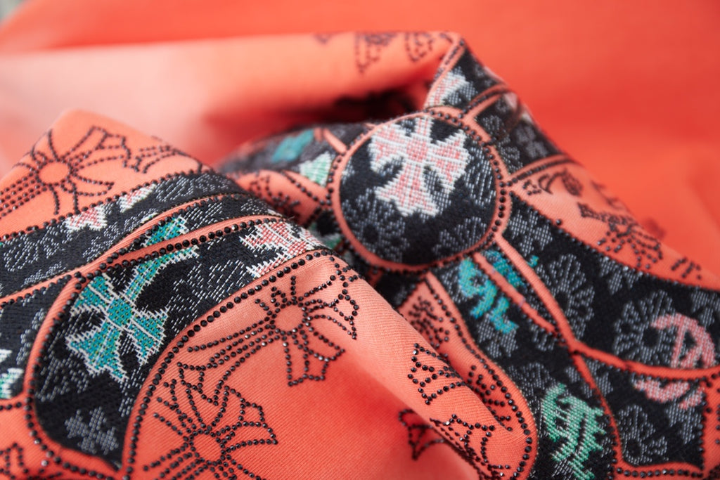 Coral T-shirt with detailed cross graphic patch pattern