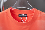 Coral crew-neck T-shirt with interior neckline brand tag