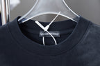 Dark short-sleeve T-shirt neckline with ribbed crew collar and inner tag.