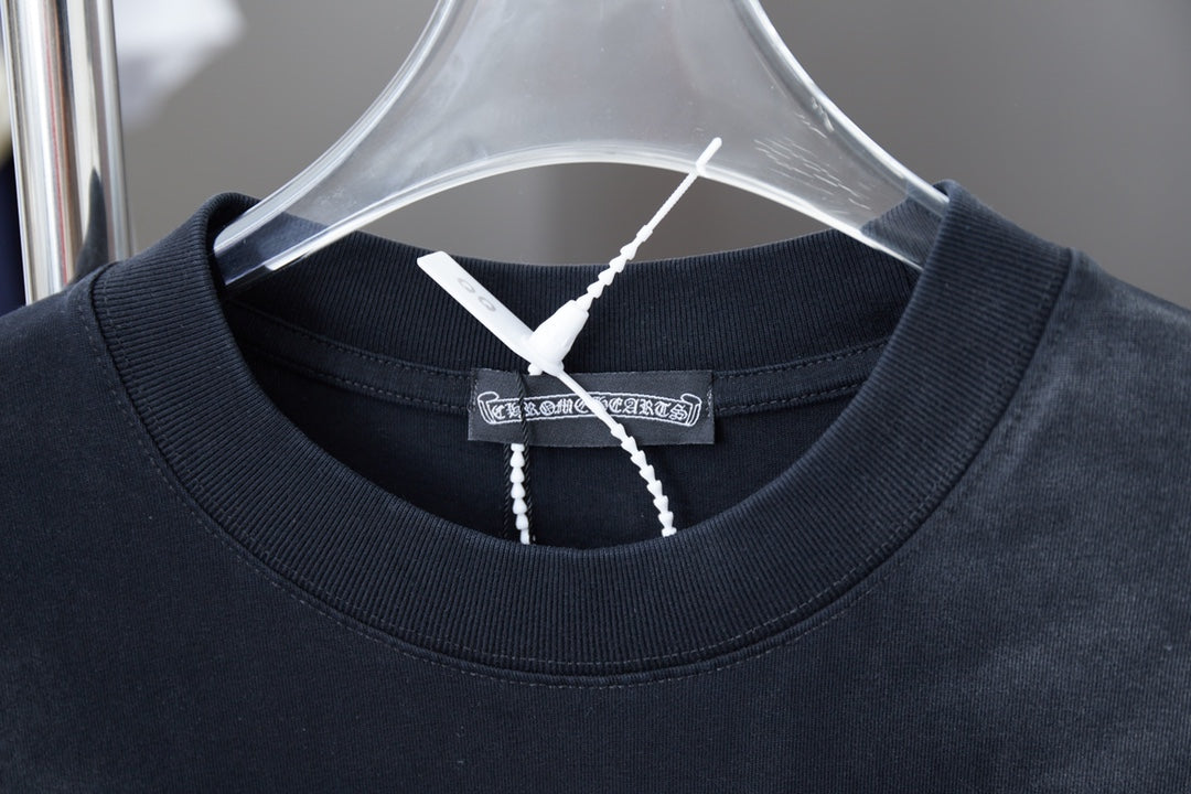 Dark short-sleeve T-shirt neckline with ribbed crew collar and inner tag.