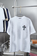 White short-sleeve T-shirt with small cross patch graphic on the chest