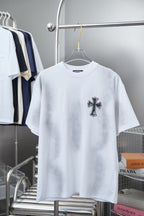 White short-sleeve T-shirt with small cross patch graphic on the chest